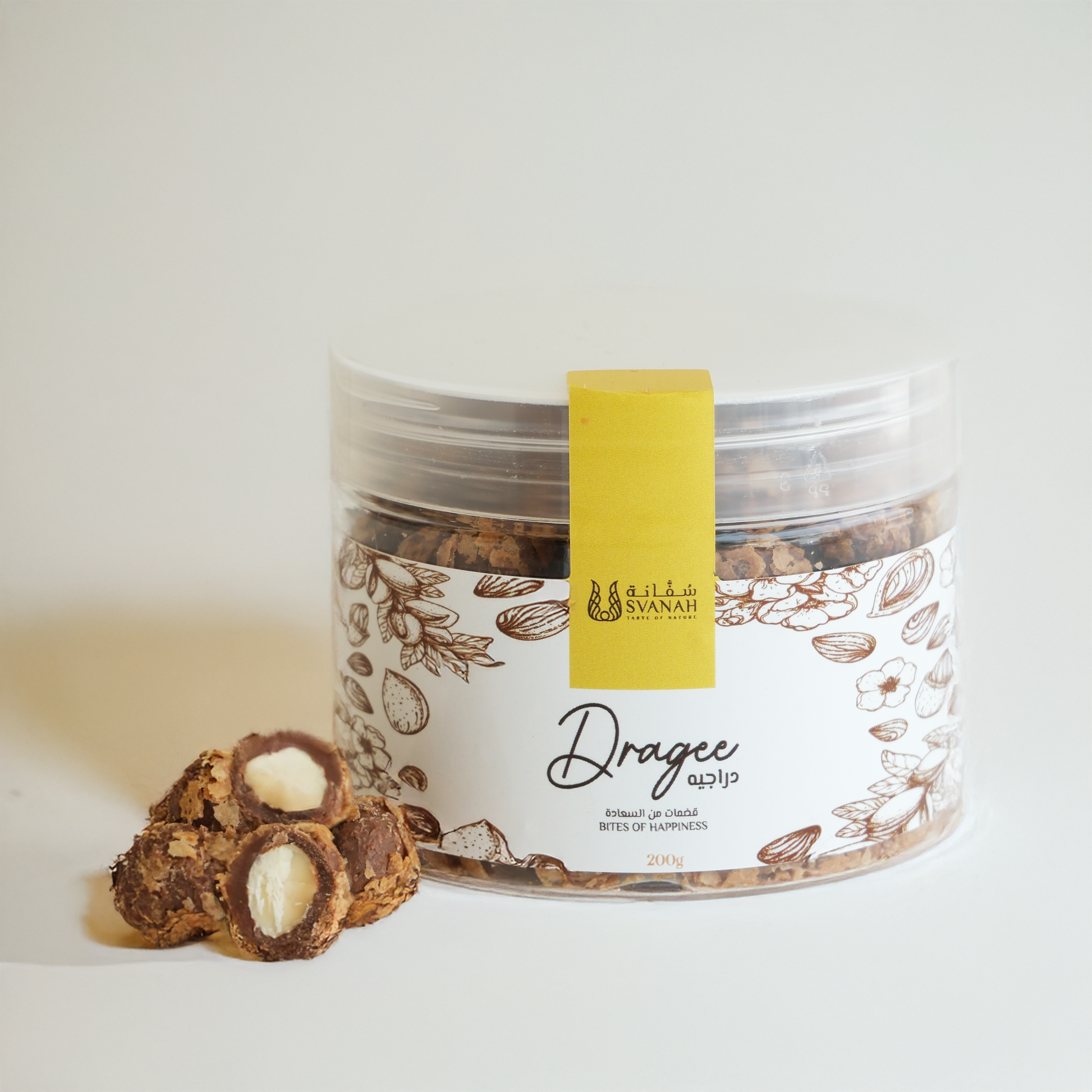 Jar of dragees with a yellow label on a white background