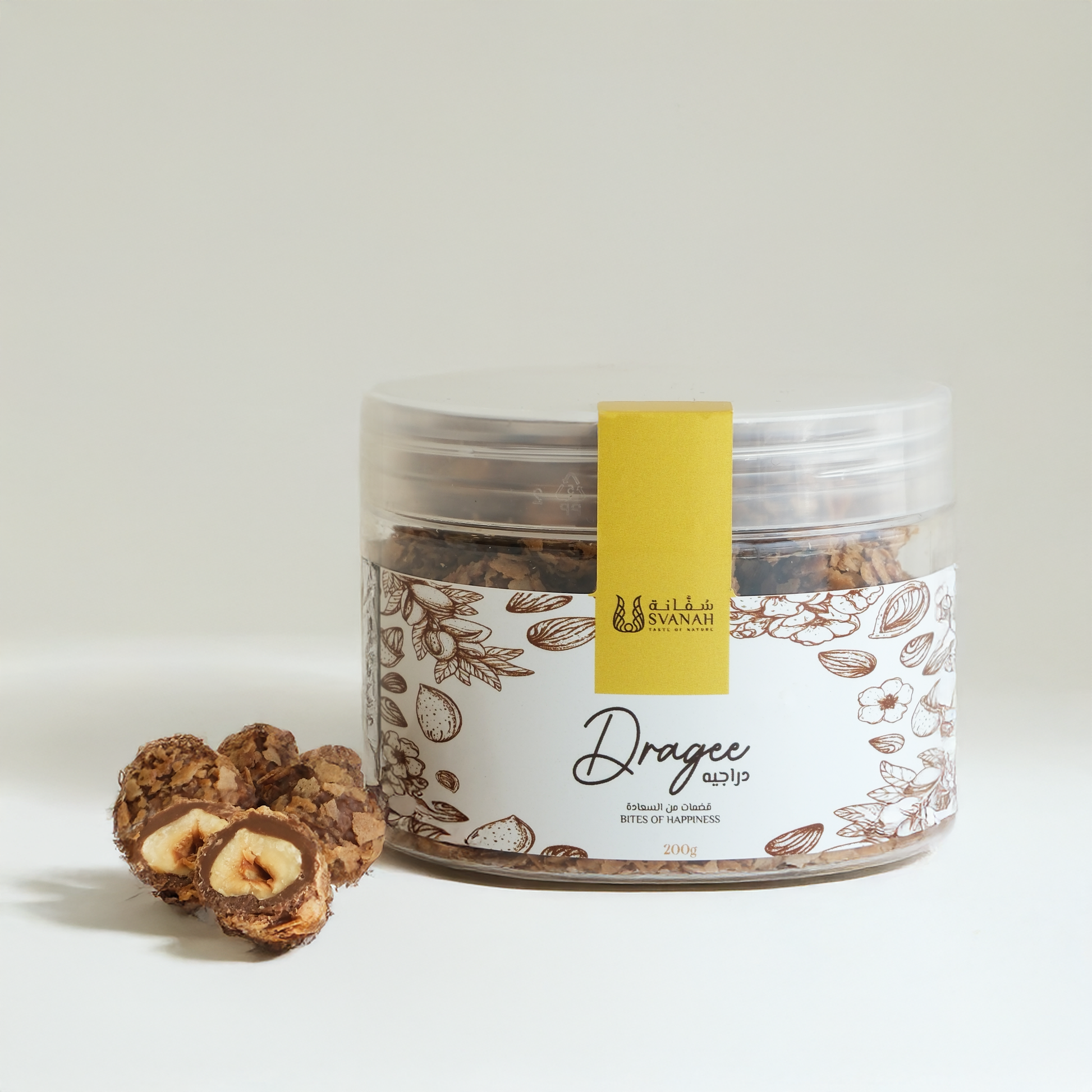 Jar of dragees with a label on a light background