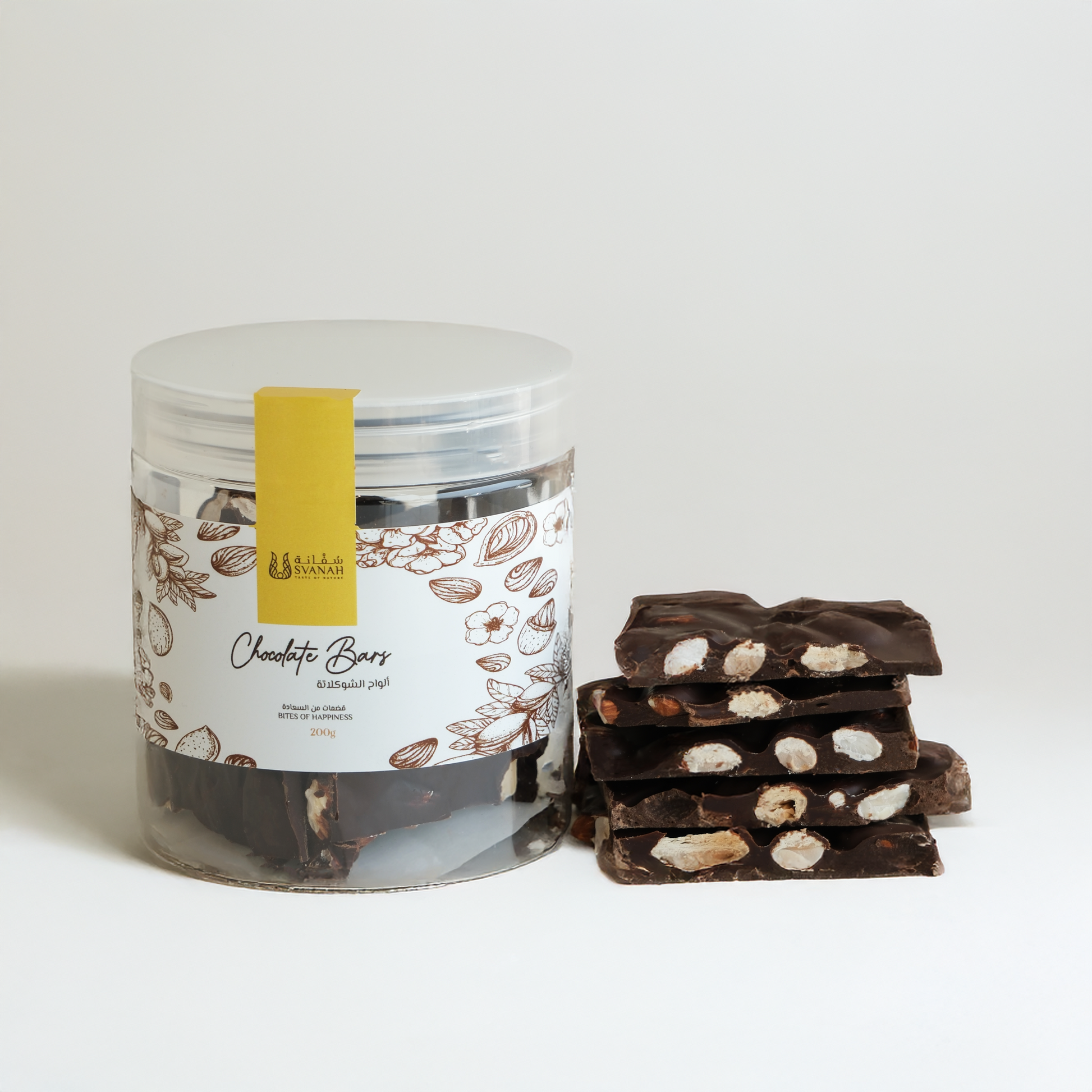 Jar of chocolate bars with a stack of broken chocolate pieces on a light background