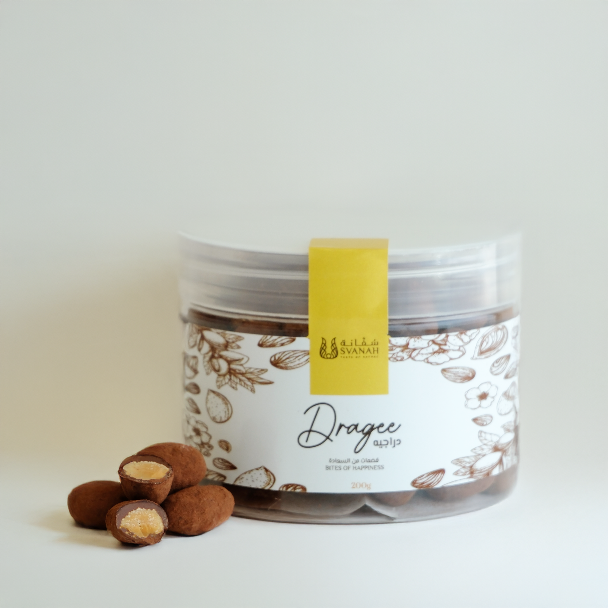 Jar of dragees with a yellow label on a white background