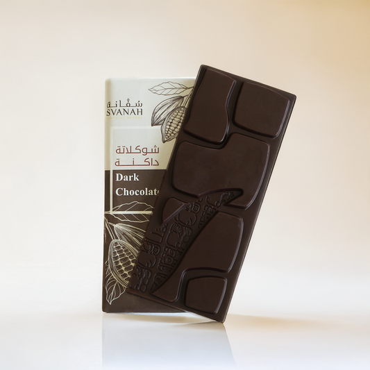 Dark chocolate bar with packaging on a white background