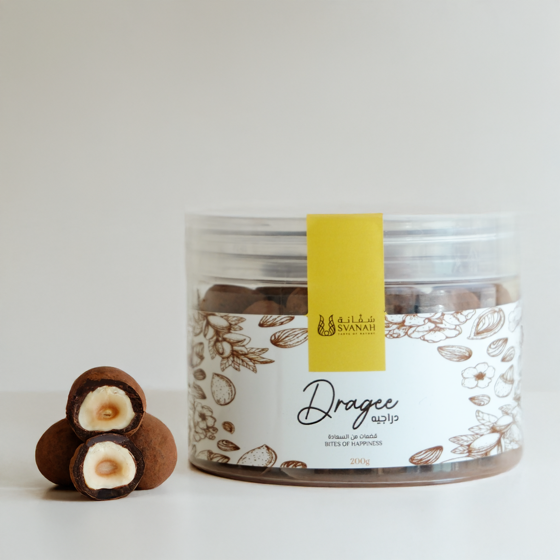 Jar of dragees with a yellow label on a white background