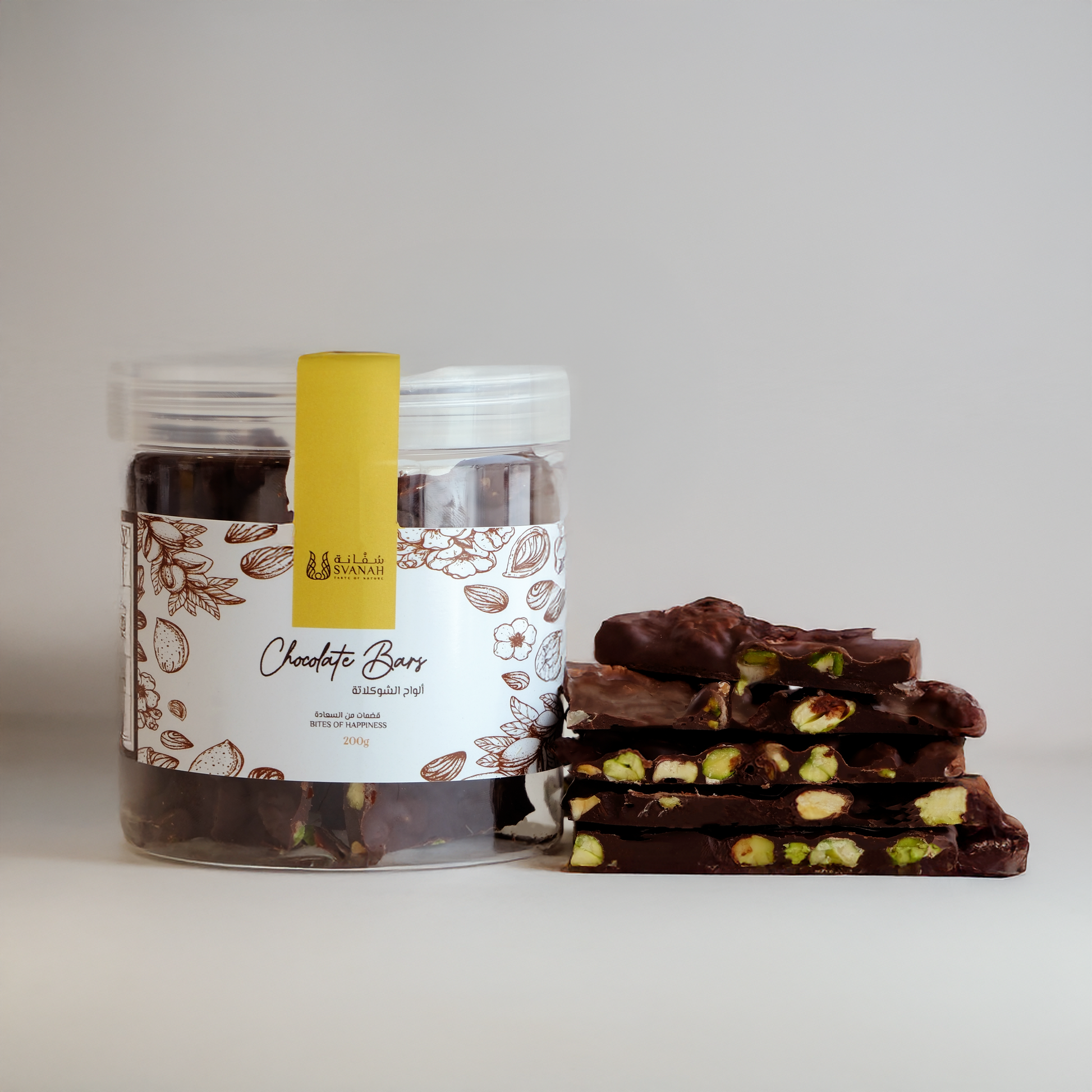 Jar of chocolate bars with a stack of chocolate bars on a white background