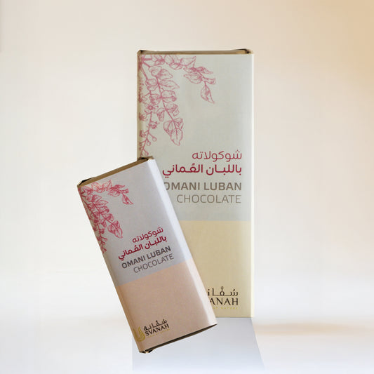 Two Omani Luban chocolate bars with decorative packaging on a white background
