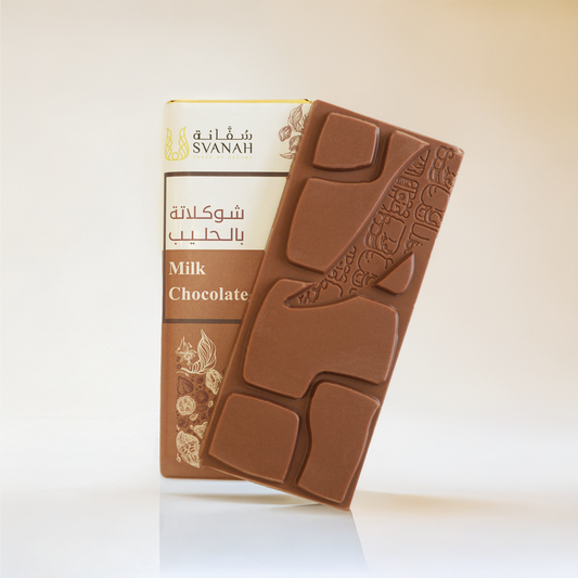 Svanah milk chocolate bar with packaging on a light background
