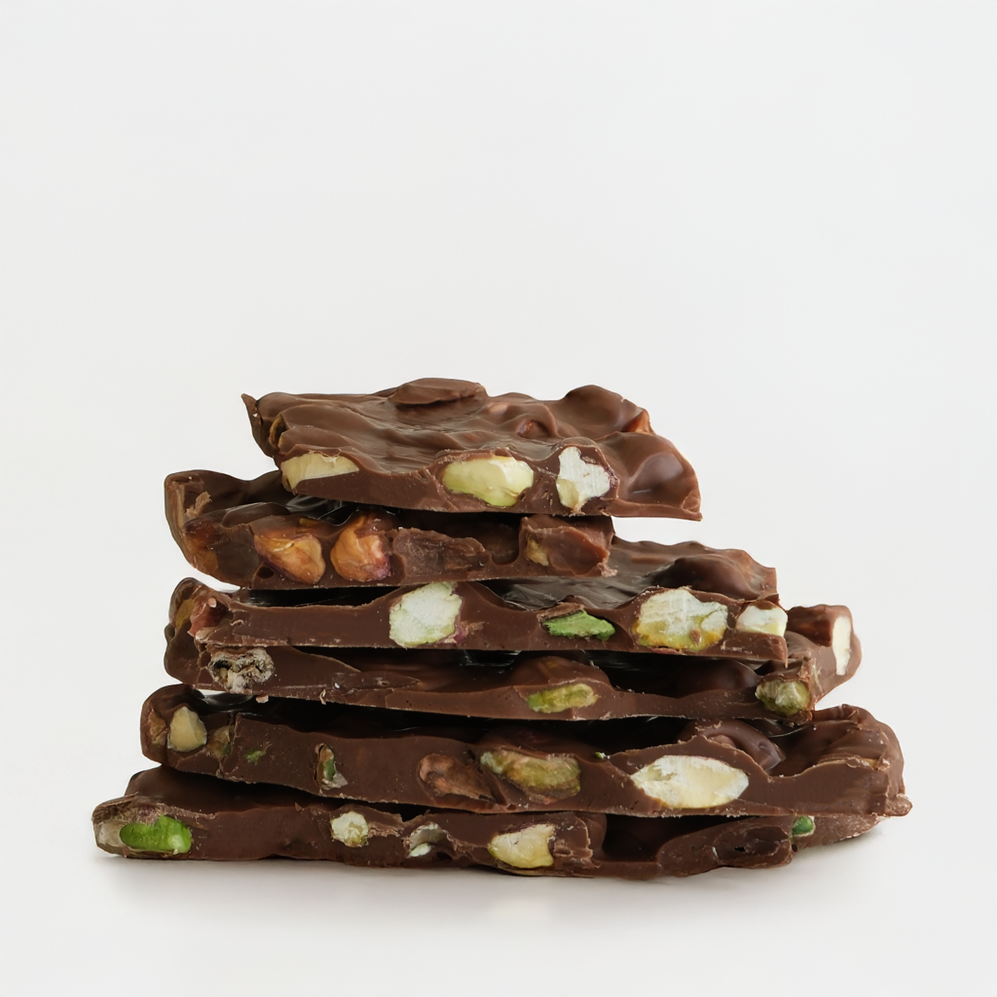 Stack of chocolate with nuts on a white background