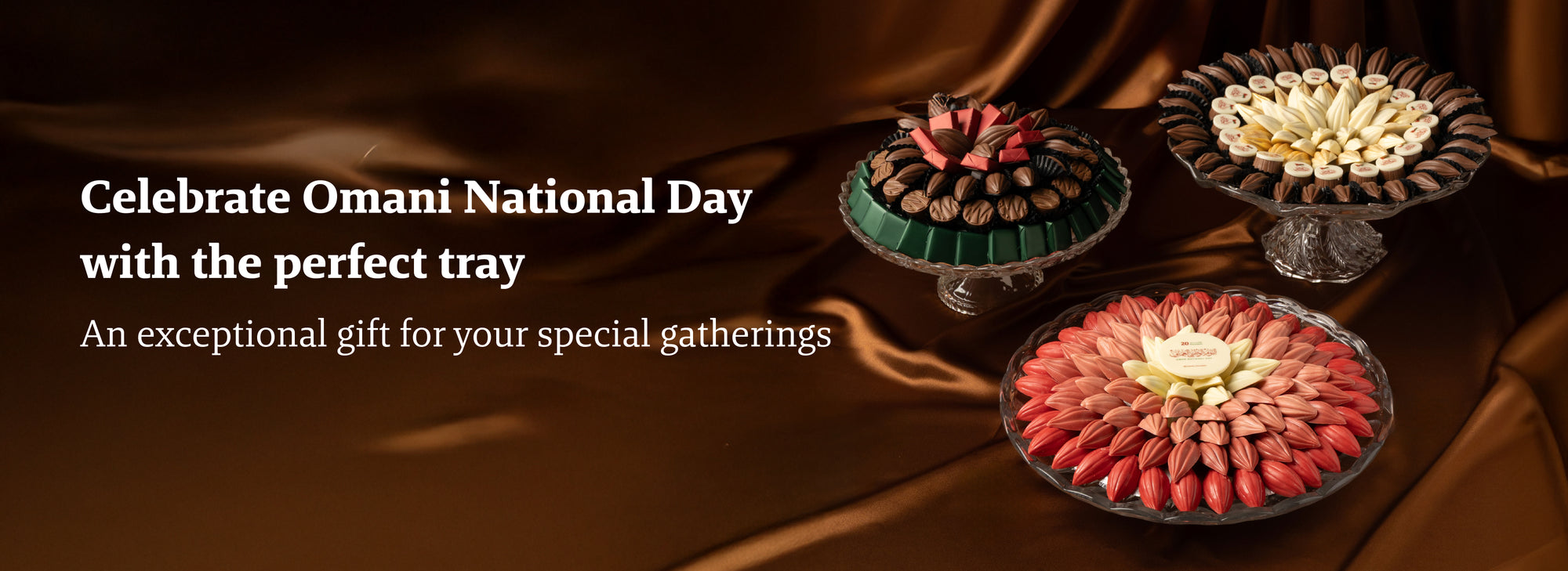 Decorative trays with Omani National Day Chocolate trays on a brown background, celebrating Omani National Day.
